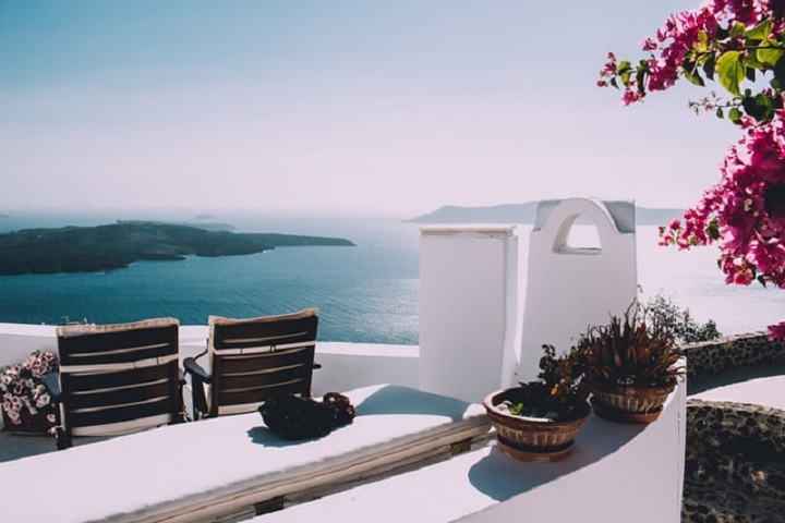 white greece inspired mansion overlooking the see