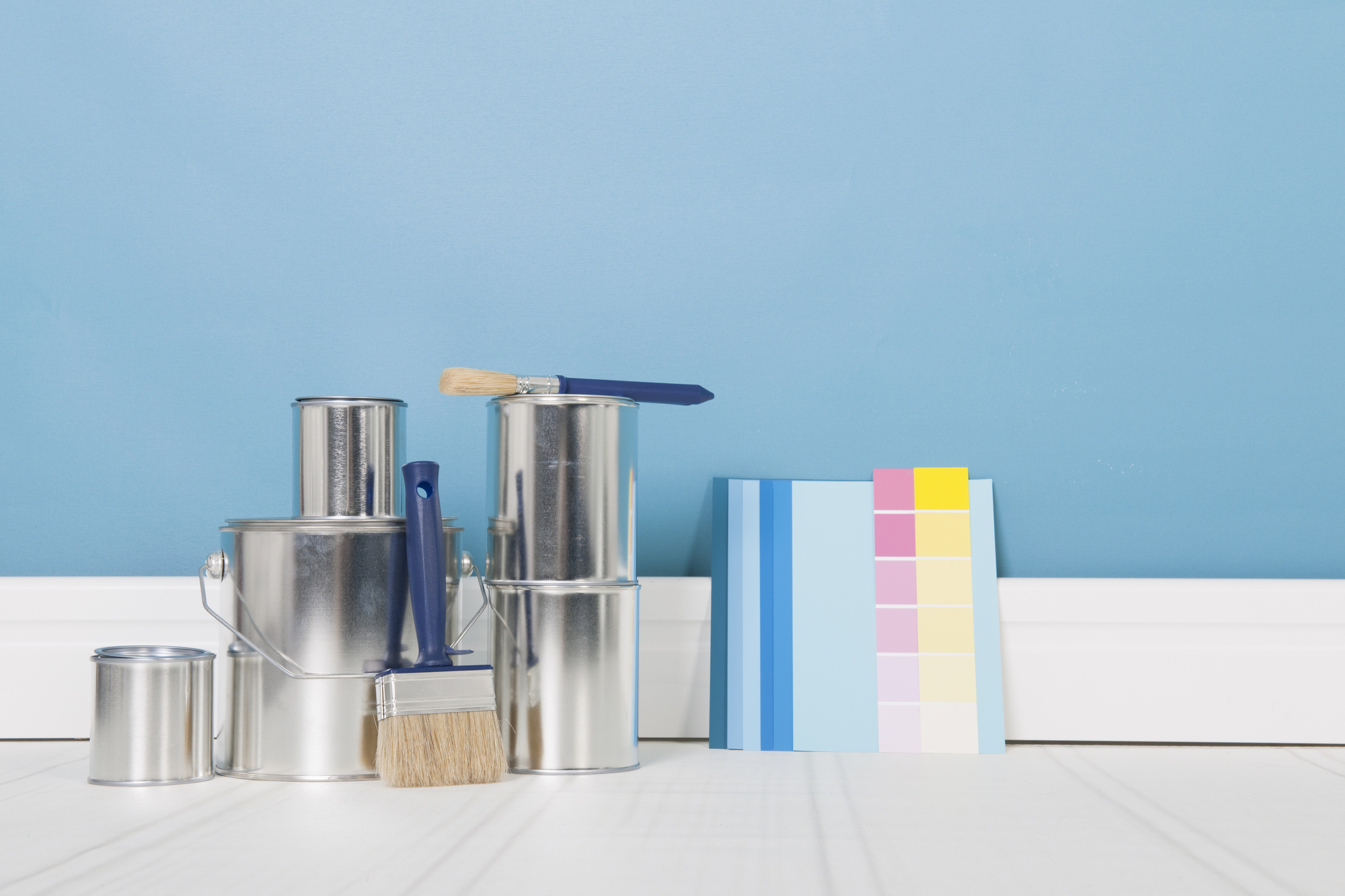Painting the interior with tins and brushes